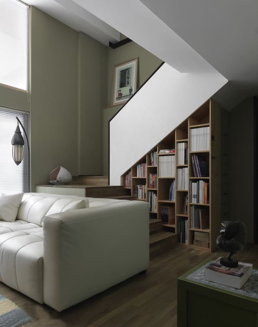 Installed open shelving below a staircase